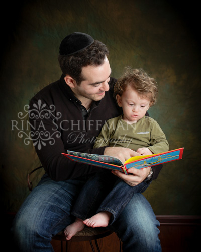 father son portrait reading 